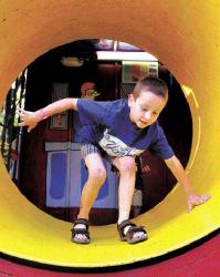 CHRIS KELLY staff Lee Stabler, 7, of Eatontown makes his way through the spinning tunnel at the West Long Branch Community Fair June 24.