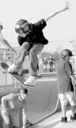 PHOTOS BY CHRIS KELLY staff Above, Red Bank&rsquo;s Charlie Pontone, 14, catches major air as he tries out some skateboarding tricks at the SkatePlex in Long Branch while Jad Magazino (left photo), of Monmouth Beach, checks out the bowl. 