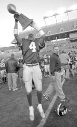 JEFF GRANIT staff Senior Gerald enjoys his time with the championship trophy. 