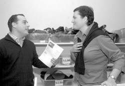 FARRAH MAFFAI staff Vincent Puma (l) and Victoria Stelmach, director of development for The Arc of Monmouth, talk during the grand reopening of the newly renovated Arc of Monmouth Thrift Shop, Red Bank.
