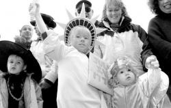Nicholas Bausenwein, 4, Eatontown, holds his torch high during judging for the        costume contest during the Eatontown Halloween parade Oct. 29.