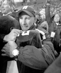 JEFF GRANIT staff Middletown South head football coach Steve Antonucci hugs his star running back Knowshon Moreno following the Eagles&rsquo; 22-0 win over Newark&rsquo;s Shabazz High School in the state finals on Sunday in Piscataway. It marked the Eagles&rsquo; 36th straight win and their third-consecutive state championship.
