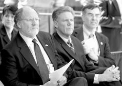 PHOTOS BY CHRIS KELLY staff Above Gov. Jon S. Corzine sits next to U.S. Rep. Frank Pallone and Rep. Rush Holt at a news conference prior to the bill signing of the Fort Monmouth Economic Revitalization Act into law. Below, local politicians, military staff and members of the public attend the news conference at Gibbs Hall, Fort Monmouth, to witness Corzine sign the bill that will determine the future reuse of the fort.