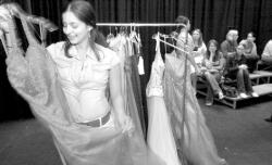 Long Branch high school seniors Ann Goncalves (above) and Ana Alvarez (left) look at a dresses at a prom dress sale hosted by the Monmouth University Public Relations Student Society of America on April 26.