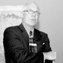 Tony MacDonald opens the forum at Monmouth University on global warming and rising sea levels. 