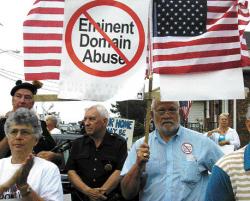 GLORIA STRAVELLI Harold Bobrow (r), who stands to lose his home to redevelopment, makes his feelings known at a rally in Long Branch last Friday.