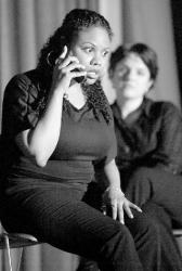 Antonio Marrero, N.Y., acts out a scene with Lina Sarrapochiello during a        performance of "Yo Soy Latina" at Monmouth University's Anacon Hall Sept. 19.