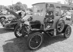 Clockwise from top right, Alona Sunger (r-l), 7, Ariel Sunger, 12, and Michelle Clark, 12, Ocean Township, watch as Bubbles (Lin Magner) puts the finishing touches on a balloon hat at the third annual Ocean Township Fall Festival held Sept. 30 at Joe Palaia Park. An antique car show was among the attractions. Oakhurst Fire Company member Tom Reu explains the safety gear he is wearing to Benjamin Jiras, 3, Oakhurst. Connor Laken, Oakhurst, takes a wild trip down an inflatable slide.  
