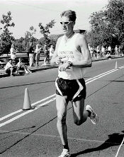 Rich Bostwick crosses the line first to win the 10K race. 