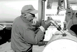 JEFF HUNTLEY  Ron Applegate of Monmouth Petroleum fills a heating oil tank in Englishtown Monday. 