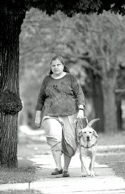 JEFF HUNTLEY  Linda Newton and her guide dog, Daisy, go for a leisurely stroll outside their Jamesburg home. Newton is one of the first students of the Guide Dog Foundation for the Blind&rsquo;s school in Smithtown, N.Y., to take on home training, a fairly new concept that is fast gaining in popularity. 