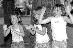VERONICA YANKOWSKI Taylor Brooks, Emily Conroy and Dana Brooks (l-r) entertain their families with their rendition of the chicken dance at the Middlesex County Fair in East Brunswick on Monday.