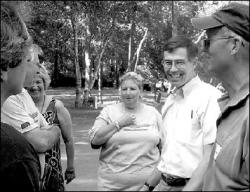 CHARLES W. KIM Rep. Rush Holt (D-12th District) talks to members of the Gold Wing Road Riders Association during a picnic for supporters at Reichler Park, South Brunswick, on a recent Sunday afternoon.