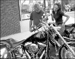 Hector and Stacy Sobel check out a Harley-Davidson motorcycle in downtown South River last Thursday.