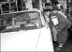 Anthony and Frank Bella, of Sayreville, look at a 1961 Chevrolet Impala.