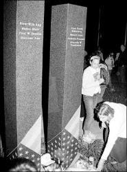 DAWNMARIE SANNWALDT  Respects are paid following the unveiling of East Brunswick&rsquo;s 9-11 Victims&rsquo; Memorial Monument (above) on the anniversary of the terrorist attacks last week. The monument is dedicated to the township residents who were lost. At left, East Brunswick resident Linda Fish, daughter Emily (c) and friend Danielle Schayek try to keep their candles lighted during the windy vigil held at the township&rsquo;s municipal complex last week.