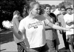 FARRAH MAFFAI Stephanie Francis, 13, throws a shaving cream pie during the South River Municipal Alliance&rsquo;s Heritage Day Saturday. It would hit a good sport in South River High School junior Robert Hickey.