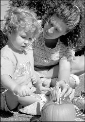 Pride in Milltown Day Saturday included art  projects enjoyed by  22-month-old Emily (above) and her mom, Tammy Sullivan.