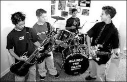 JERRY WOLKOWITZ Members of Against the Grain, from left, E.J. Green, Eric Conceicao, J.J. Ferrito and Grant Herring, rehearse in Monroe last week.