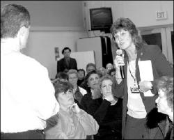 FARRAH MAFFAI Shirley Read, a teacher at East Brunswick High School, voices her concerns to Gov. James E. McGreevey at last week&rsquo;s town meeting at the school.
