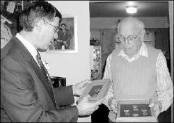 Congressman Rush Holt (D-12) presents World War II veteran Nathan Striesfeld with the medals he has long been due on Monday.