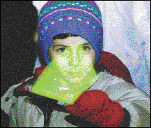 FARRAH MAFFAI Daniel Parks, 6, plays with a glow stick during the sixth annual East Brunswick Holiday Celebration at the municipal complex Monday night.
