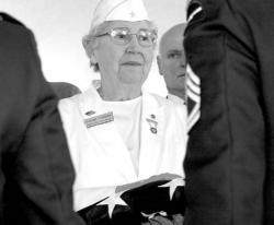 FARRAH MAFFAI During the U.S. Postal Service&rsquo;s &ldquo;Saluting Their Sacrifice&rdquo; ceremony Friday, Dorothy Oxendine, national president of the American Gold Star Mothers, is presented with the American flag in honor of the loss of her son.
