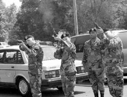 FARRAH MAFFAI Members of the 42nd Infantry Division with the New Jersey National Guard fire a gun salute during Friday&rsquo;s ceremony unveiling the Purple Heart stamp.