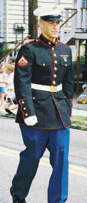 DAWNMARIE SANNWALDT Former resident Lance Cpl. Justin Visokay, on leave from the war in Iraq, marches in the parade.
