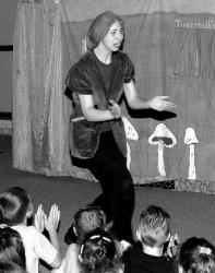 PHOTOS BY STEVEN M. BARON Aileen Goldberg of Duet Productions appears as Peter Pan during a performance at the Monroe Township Library&rsquo;s Youth Theater Festival Tuesday evening. More than 120 tickets were sold for the play. Below, area children enjoy the performance.