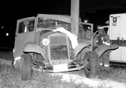 STEVEN M. BARON A 1933 Ford pickup truck whose driver lost control while turning right from Stratford Road onto Ryders Lane in East Brunswick around 7 p.m. Tuesday smashed into a telephone pole on Ryders Lane northbound. The driver, Neil Buchanan, 54, of East Brunswick, was charged with driving while intoxicated and was listed in serious condition at Robert Wood Johnson University Hospital, New Brunswick, yesterday.