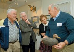 SCOTT FRIEDMAN Top: Paul Dobrosky talks about the various features of a foam decoy during Sunday's "History of Carving" event at the East Brunswick Historical Society museum on Milltown Road in East Brunswick. Bottom: A solid block of wood skillfully transformed into a lifelike sparrow. 