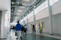 School officials are celebrating the completion of additions and renovations at Hammarskjold Middle School. Above, middle school students walk the expansive corridors, flanked with rows of windows to take advantage of natural sunlight. Right: Architectural details such as this multitiered ceiling in a chemistry classroom at the newly renovated Hammarskjold Middle School are designed to enhance the learning environment. 