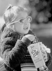 SCOTT FRIEDMAN Gabriella Tamar, 4, of East Brunswick, enjoys a snack during the recent Sukkot festival at the Chabad Jewish Center in North Brunswick. 