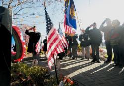 JEFF GRANIT staff Veterans Day is recognized Tuesday morning with a wreath-laying ceremony at the Monroe Township Veterans Monument, located at the municipal complex. Members of Monroe's American Legion Post 522 salute the flag. 