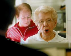 SCOTT FRIEDMAN Murial Cadic of East Brunswick, a longtime member of Trinity Presbyterian Church, performs warm-up exercises during rehearsals for the upcoming show by the combined choirs of the Cranbury Road church and the Sacred Heart Church on Throop Avenue in New Brunswick. The performance will take place at 7:30 p.m. Dec. 6. See story, page 6. 