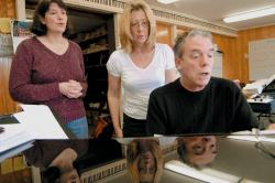 PHOTOS BY SCOTT FRIEDMAN Musical Director Edward L. Krogstad Jr. of Matawan goes over some melodies with Patty Mancuso of Piscataway (l) and Beverly Marsh of South River during a rehearsal Friday for the Dec. 6 combined choir concert. Mancuso belongs to Sacred Heart Roman Catholic Church of New Brunswick, while March is a member of Trinity Presbyterian Church in East Brunswick. 