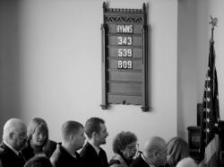 PHOTOS BY JEFF GRANIT staff Left: Mourners sing hymns during the funeral services for Middlesex Country Freeholder Director David B. Crabiel. Right: Crabiel's wife, Mary, is comforted by family and friends as she leaves St. Paul's United Church of Christ in Milltown. 
