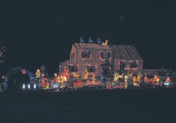 JENNIFER AMATO Billy Kloos, 14, and his brother Ryan, 12, worked since October decorating their Sterling Court home for the holidays. The family's "Christmas Light Spectacular" includes 114,372 lights, approximately 100 lawn ornaments and eight inflatables. Lights are on from 5:30 to 10 p.m. and until 11 p.m. Fridays and Saturdays. Santa Claus will make a visit from 5:30 to 11 p.m. Dec. 19. The home is off Summerhill and Salem roads in East Brunswick. 