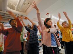 JEFF GRANIT staff Students from Spotswood's Appleby Elementary School perform during the annual holiday party at the borough's Office on Aging on Dec. 17. Nick Toth (from right) and Kelly Kresge take part in the spirited dance and singalong. More photos, page 17. 