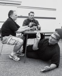 Above: Scott Randolph (l-r), Kris Longwell and Wesley Loon rehearse a scene from "Fade Out at Clo-Achers" last week at the East Windsor Library. The original comedy by Monroe residents Myra Danon and Meryl Berness steps beyond the security gates of an active adult community known as Clo-Achers to observe the interactions and chicanery among its mature and not-somature residents. Shows run July 10-26 at the Empire Diner Restaurant Dessert Theater, 4135 Route 9 north, Freehold Township. Tickets are $20; $18 for seniors. Dessert and coffee are included. For tickets, email berdanhand@gmail.com or call 609-443-1320 or, after 5 p.m., 908-208-2750. Right: Leslie Hochman runs through a scene from the play. 