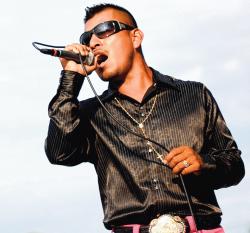  Vidal Castro, of the Castro Brothers, performs at the block party, which featured Latino live music and food and the opportunity to meet with artists whose work was featured in &ldquo;Crossing Borders.&rdquo; 
