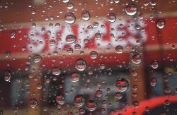  Raindrops cascade down a window outside of Staples in Ocean Township on Feb. 13.  STAFF PHOTOGRAPHER ERIC SUCAR 