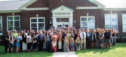  More than 70 alumni of Markham Place School in Little Silver pose in the same spot where the eighth-grade graduating class picture is taken each year. 