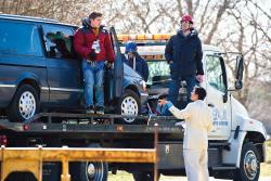  Left: Assistant producer Aashray Sardana talks with cameraman Noah Rauchwerk (l) on March 20 during the Holmdel High School TV Society&rsquo;s production of a national public service announcement about the dangers of texting while driving. Above: Rauchwerk (l) and his adviser, teacher David Kaiserman, film a scene. About 30 Holmdel High School students participated in filming the PSA, which was done on Roberts Road with the assistance of the Holmdel police, fire department, EMS and local towing companies.  PHOTOS BY LAUREN CASSELBERRY 