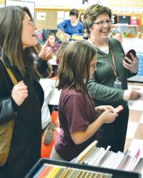  Elaine Berman (r) tallies Gracie Krall&rsquo;s final score in a game of &ldquo;Jeopardy&rdquo; staged by fourth-graders at St. Leo the Great School in Lincroft on Feb. 2. The game was part of the activities celebrating Catholic Schools Week, which included classroom visits by parents like Jeannette Arias (l), Teacher Appreciation Day and Student Appreciation Day, when the students celebrated with ice cream sundaes and video games. 