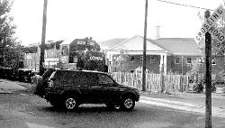 JERRY WOLKOWITZ  A Conrail freight train approaches Conover Street between Elm and Mechanic streets in Freehold Borough on May 10. A push for passenger rail service could one day make sights like this commonplace in the borough. 