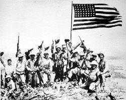 Members of Easy Company, 28th Marine Patrol, pose for a photo taken by Associated Press photographer Joe Rosenthal atop Mount Suribachi, Iwo Jima. PFC Fred John Walczak, of Manalapan, is fifth from the right. 