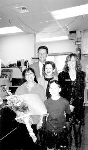 Marlboro school district officials met for an impromptu gathering to present Pat Kilimnik, cafeteria manager, (l), with flowers as a token of gratitude for saving the life of third-grader Jeremy Malvin (r) on whom she performed the Heimlich maneuver when he was choking during lunch at the Asher Holmes School. Also pictured are Superintendent of Schools Dr. David Abbott, Asher Holmes Principal Patricia Dottori and Dianna Sullivan, manager of Chartwell&rsquo;s Educational Dining Services. 