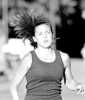 JERRY WOLKOWITZ Kristen Alberts, of Freehold Township, nears the finish line ahead of the pack at the Freehold Area Running Club&rsquo;s 5K race at Monmouth Battleground State Park last Wednesday. 